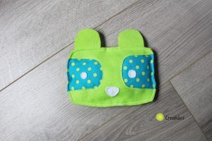 Doudou en feutrine vert et bleu petit raton