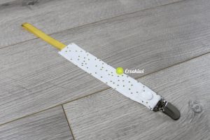 Attache tétine pince métal ruban doré et motif doré