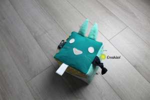 Dé d’éveil vert et jaune lapin