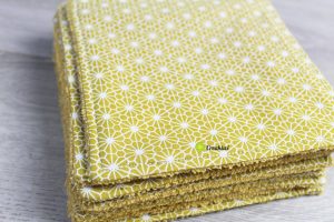 Minis serviettes de table dans les tons jaune moutarde